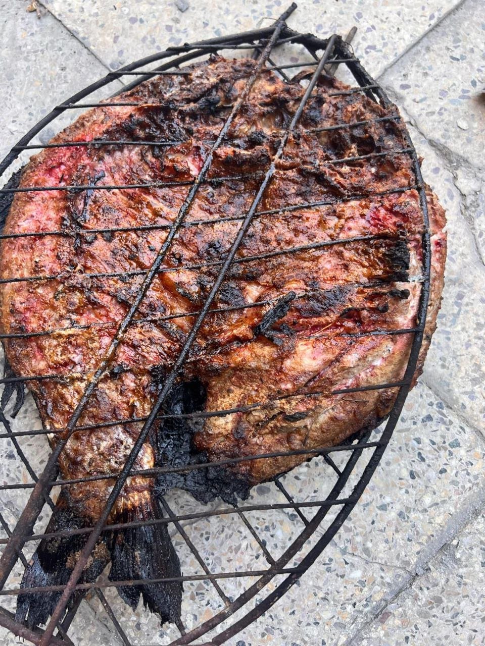 Masgouf grilled over open fire